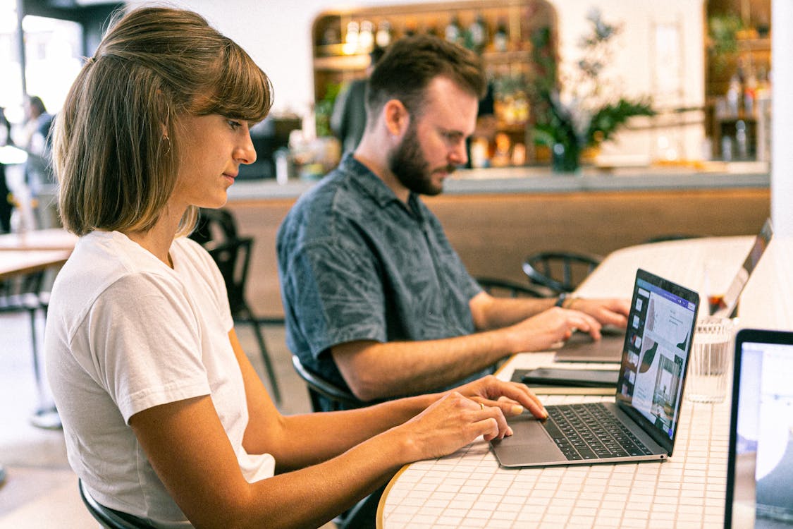 Two persons engaged in their freelancing work