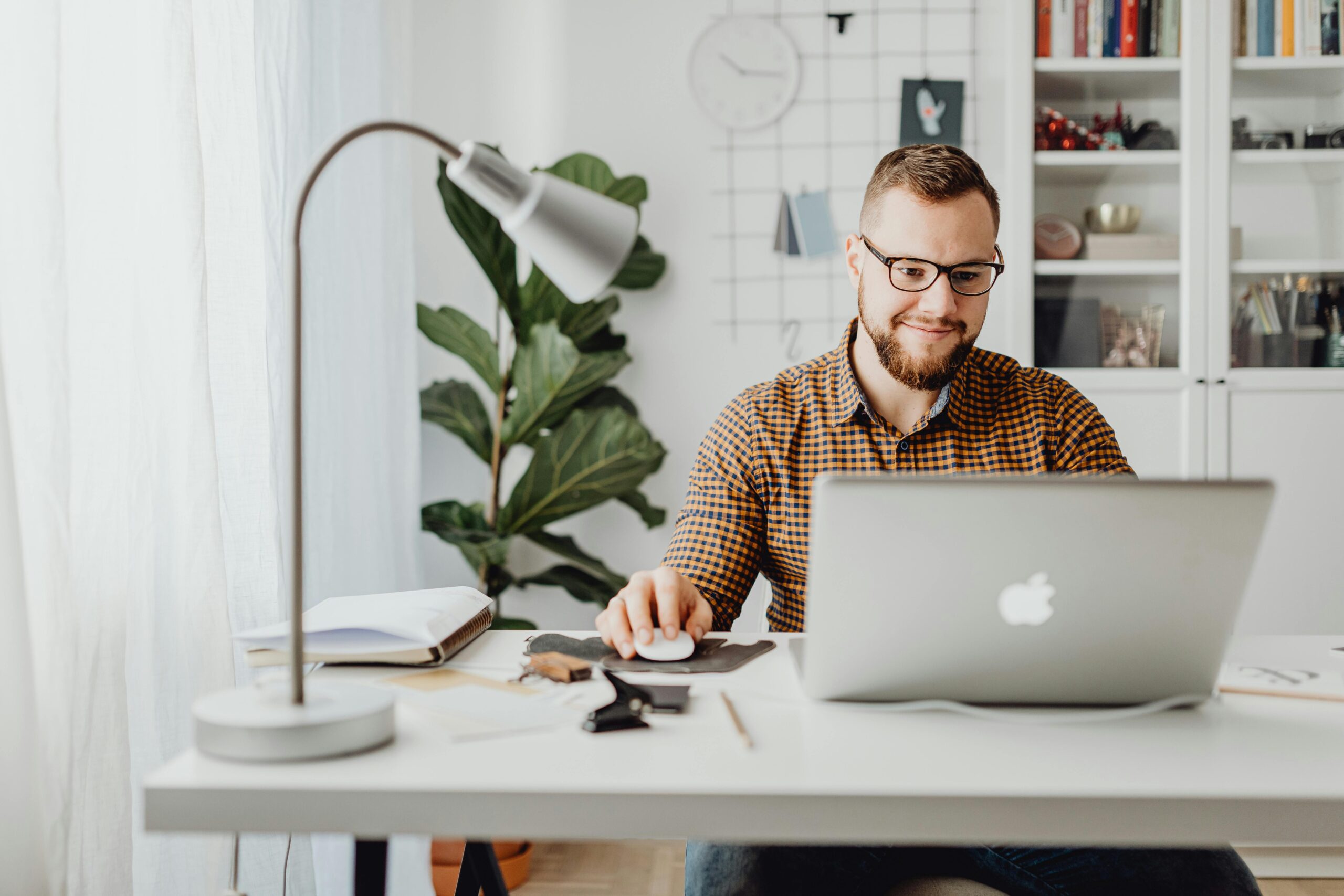 A man sitting at his desk - working.