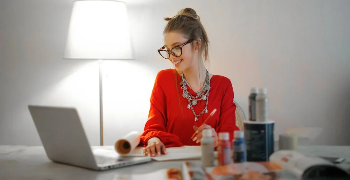 A self-employed woman working at her desk